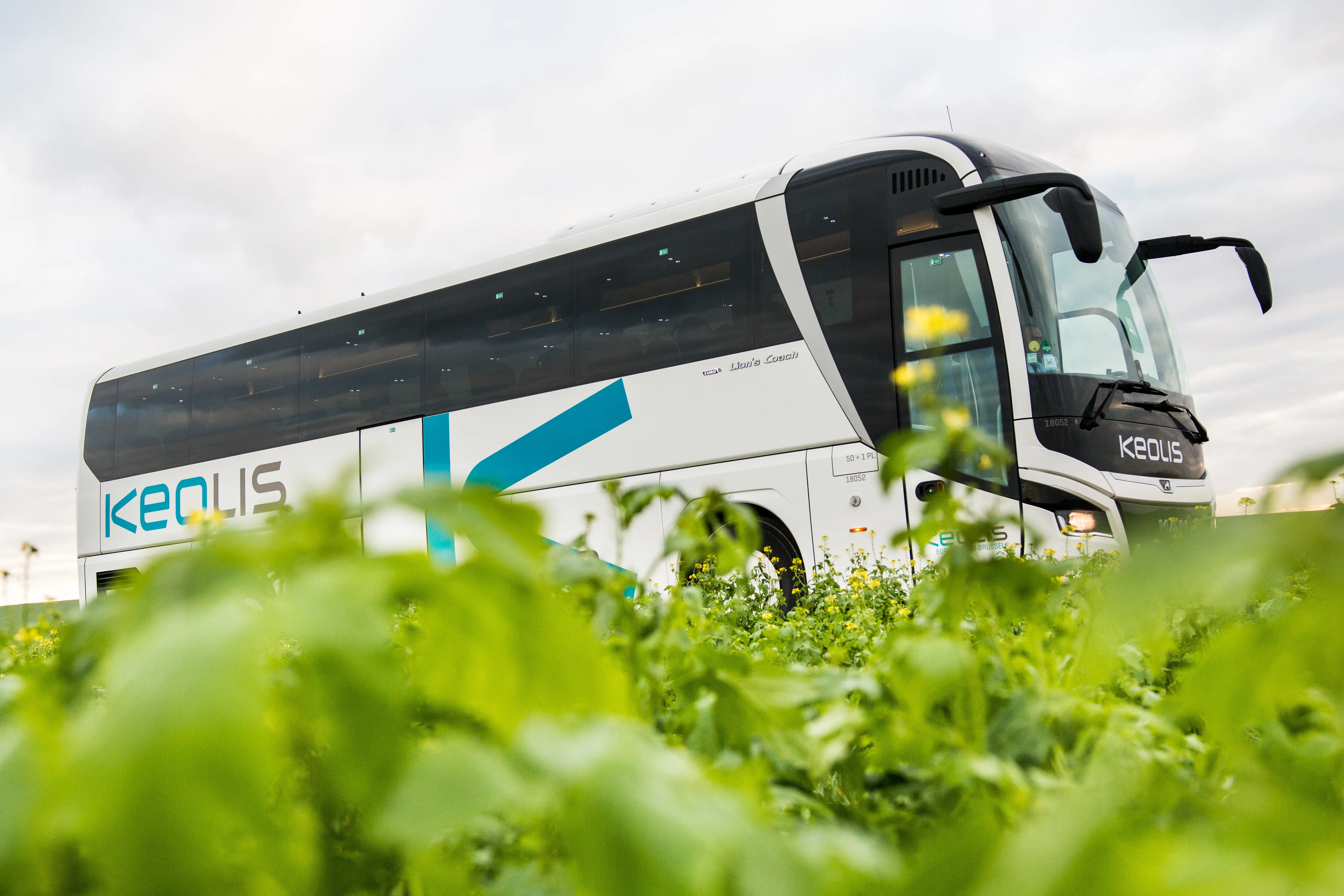 Keolis coach driving through green fields